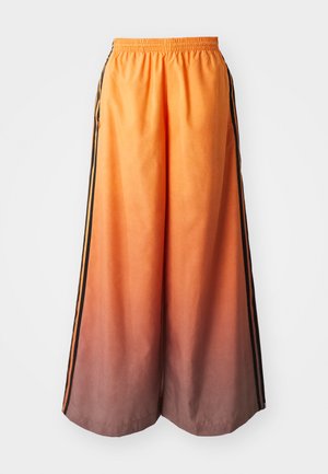 Pantalons larges dégradés orange avec une bande latérale noire, dotés d'une taille élastique et d'un matériau léger.