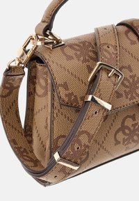Brown textile handbag with monogram pattern, featuring a gold-tone hardware clasp and adjustable strap, structured design and textured surface.