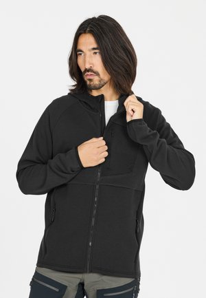 Svart zip-up hoodie med texturerad övre panel, ficka med dragkedja fram och sidofickor. Slät tyg med en åtsittande design.