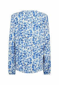Bluzka z długim rękawem w białym kolorze z niebieskim kwiatowym nadrukiem. Miękki materiał, okrągły dekolt i wszyte rozdwojenia u dołu.