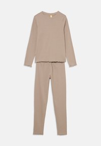 Two-piece loungewear set in a light beige color, featuring long sleeves and fitted pants with frayed hems. Soft, ribbed texture throughout.