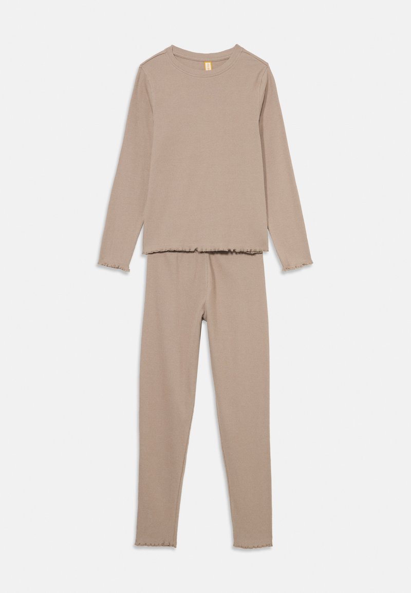 Two-piece loungewear set in a light beige color, featuring long sleeves and fitted pants with frayed hems. Soft, ribbed texture throughout.