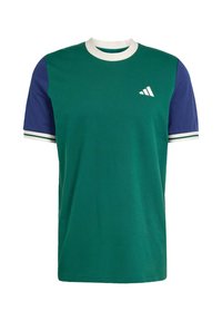Green cotton t-shirt with navy short sleeves, white collar, and cuffs. Features a white logo on the chest. Regular fit and smooth texture.
