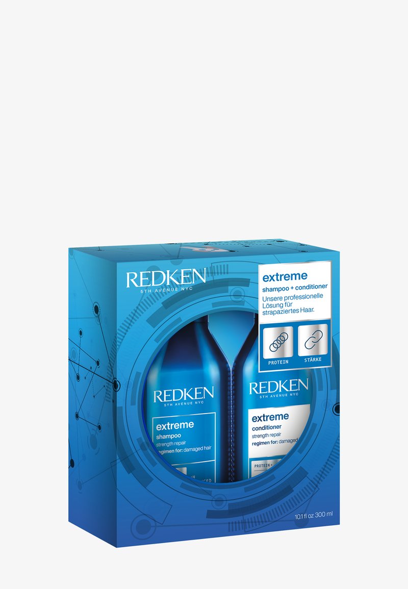 Ensemble shampooing et après-shampooing Redken Extreme dans un emballage bleu pour la réparation de la force des cheveux abîmés, avec des icônes de protéines et de soins.
