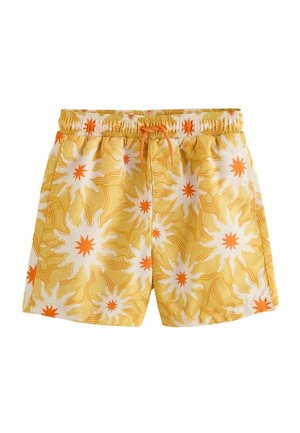 Kollased ujumispüksid valgete ja oranžide päikesekiirte mustritega ning oranži paelaga vöökoht.