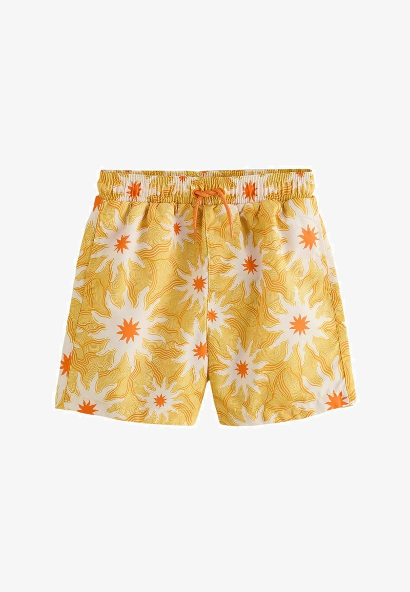 Short de bain jaune avec des motifs d'éclats de soleil blancs et orange et une taille à cordon orange.