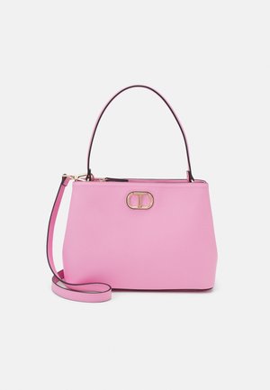 Pink leather handbag with short handle, detachable shoulder strap, gold oval logo clasp, and zip closure on top.