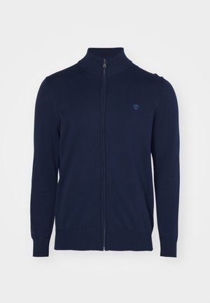 Marine blauwe zip-up sweater met een hoge kraag, gemaakt van een gladde gebreide stof, met lange mouwen en een klein, subtiel logo op de borst.