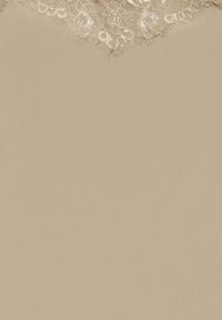 Tissu beige avec une bordure en dentelle florale complexe présentant de petits motifs circulaires et floraux sur le bord supérieur.