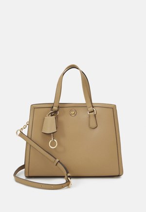Tan leather handbag with gold-tone hardware, dual top handles, detachable shoulder strap, and a charm detail. Structured rectangular design.