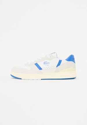 White and grey sneaker with blue accents. Made of suede and leather, featuring perforations, flat laces, and a thick rubber sole.