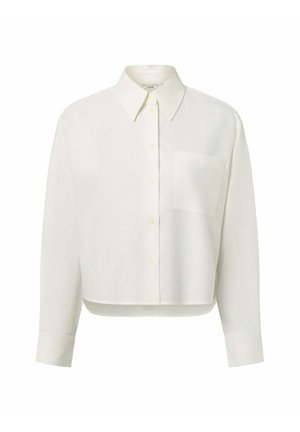 White cropped shirt with a collared neckline, long sleeves, a single chest pocket, and button front closure. Made from a soft, textured fabric.