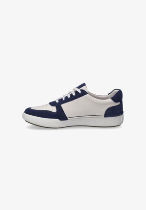 White sneaker with navy suede accents, round toe, textured rubber sole, and white laces. Side view showcasing contrasting materials.