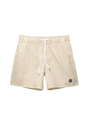 Beige fürdőnadrág rugalmas derékkal, fehér zsinórral, oldalsó zsebekkel és egy kis fekete logóval az alsó bal oldalon.