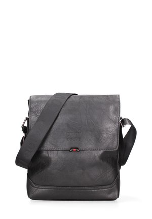 Sac bandoulière en cuir noir texturé avec rabat, bandoulière noire réglable et logo subtil "Coveri active" à l'avant.