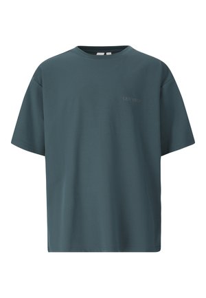 Mørkegrøn oversized T-shirt med korte ærmer, rund halsudskæring og diskret "LES ARCS" tekst på venstre bryst.