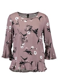 Blommig blus i mauve med svart och vitt blommönster, rund halsringning, trekvarts ärmar med trumpetsform och en volang i nederkant.