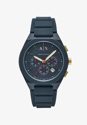 Černé hodinky Armani Exchange s pozlacenými ručičkami, červenou sekundovou ručičkou, třemi menšími ciferníky, datovým okénkem zobrazujícím 21 a černým texturovaným páskem.