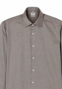 Karierte Hemdjacke mit breitem Kragen, versehen mit kleinen schwarzen und weißen Mustern. Hergestellt aus einem glatten, leichten Stoff.