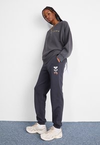 Roxy SURF STOKED BRUSHED - Tepláky - black