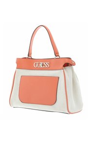 Torba płócienna w beżowym kolorze, z pomarańczowymi skórzanymi akcentami i kieszenią z przodu. Posiada srebrne logo oraz podwójne uchwyty u góry.