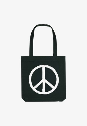 Borsa in cotone nera con un grande simbolo della pace bianco al centro. Ha manici lunghi e robusti per il trasporto.