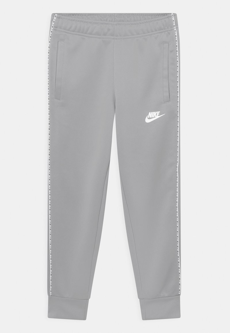 Light gray Nike track pants with side stripe detailing, elastic waistband, zippered pockets, and cuffed ankles.