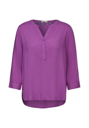 Blusa viola a maniche lunghe in un tessuto leggero e liscio. Presenta un colletto alla mandarino e tre bottoni sullo scollo. Orlo curvo.