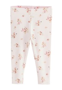 Õielised retuusid soonikkoes kangast, millel on heleroosa taust väikeste, hajutatud õiekujunditega pehmetes toonides.