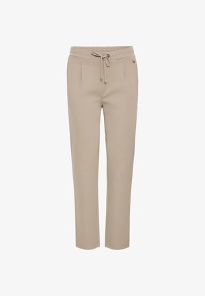 Jasnobeżowe, elastyczne spodnie z elastycznym paskiem, regulowanym sznurkiem i dwiema przednimi kieszeniami. Gładka faktura, dopasowany krój.