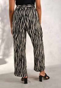 Live Unlimited London Housut - black