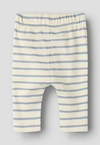 Gestreepte legging in lichte crème met skyblauwe horizontale strepen. Heeft een elastische tailleband en zachte katoenen stof. Korte lengte.