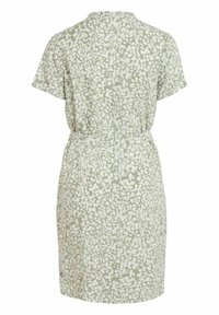 Robe à manches courtes, longueur genou, avec un motif abstrait vert clair et blanc et une ceinture à nouer, vue de dos.