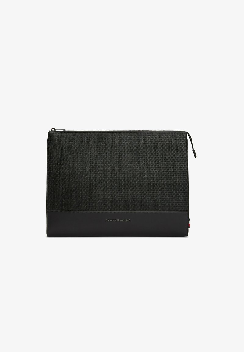 Black textured rectangular pouch with zipper closure and small Tommy Hilfiger logo on the lower front panel.