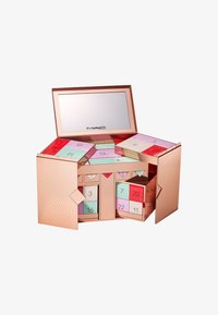 Roze-gouden adventskalender met een spiegel, met kleurrijke vakjes, een geometrisch ontwerp en genummerde deuren in pastelkleuren.