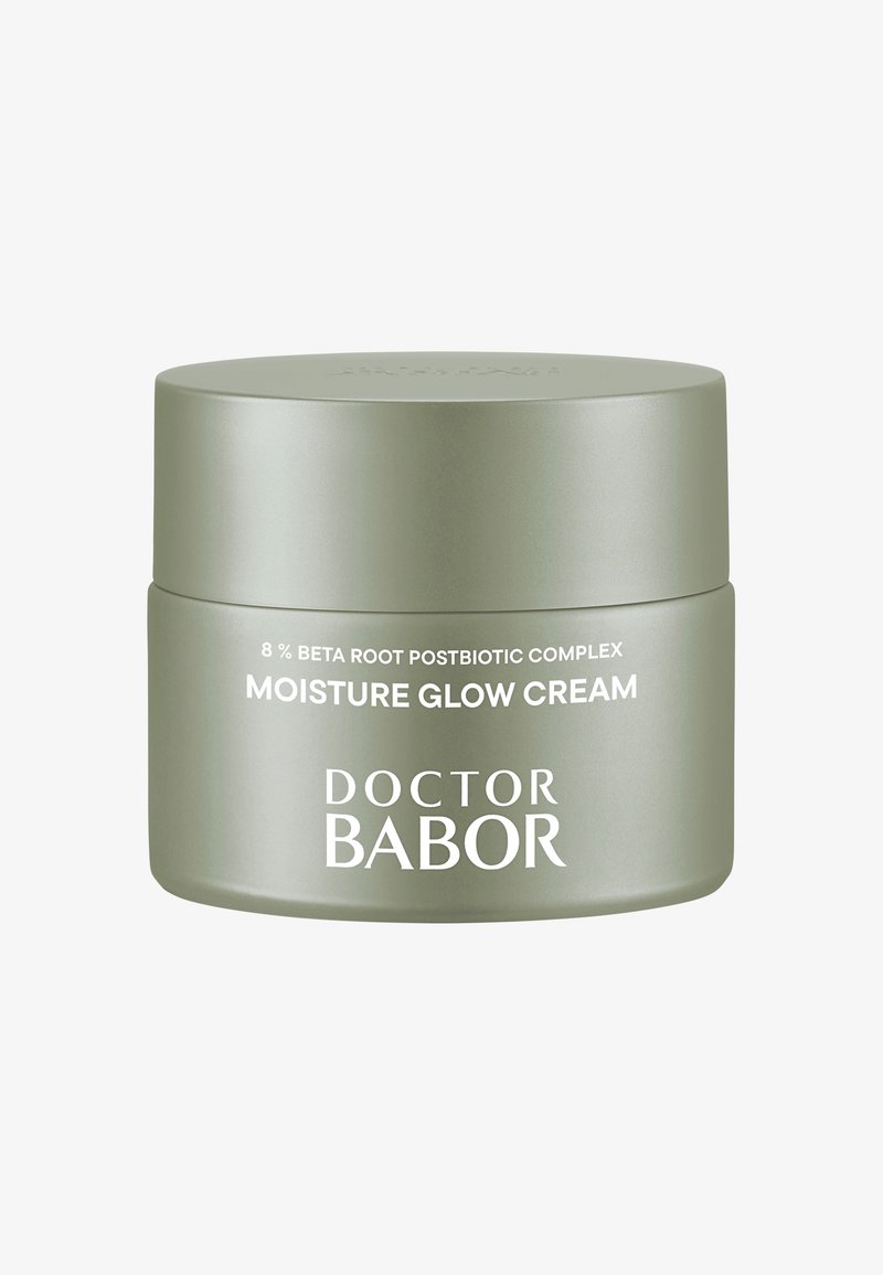 Bocal rond vert clair avec une finition mate lisse. Texte blanc affichant "DOCTOR BABOR" et "MOISTURE GLOW CREAM" à l'avant.