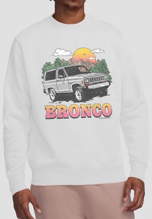 White sweatshirt with a graphic of a gray Bronco SUV in front of trees and mountains at sunset with the word Bronco in large pink and yellow letters.