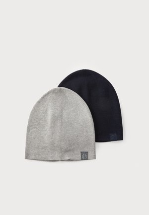 Two beanie hats: one gray and one navy, made of ribbed knit fabric. Each features a small logo patch on the fold.