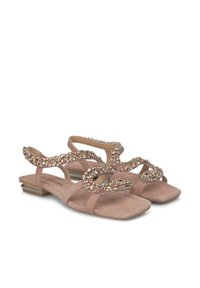 Roze suède sandalen met een lage blokhak, voorzien van een decoratieve gekruiste band versierd met sprankelende versieringen.