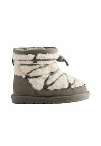 Fleece-lined boot in off-white and grey, featuring a textured surface, grey accents, and adjustable top for a secure fit.