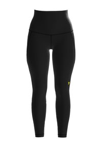 Leggings noirs taille haute avec une texture lisse, arborant un logo jaune. Le design présente une silhouette élégante et moulante.
