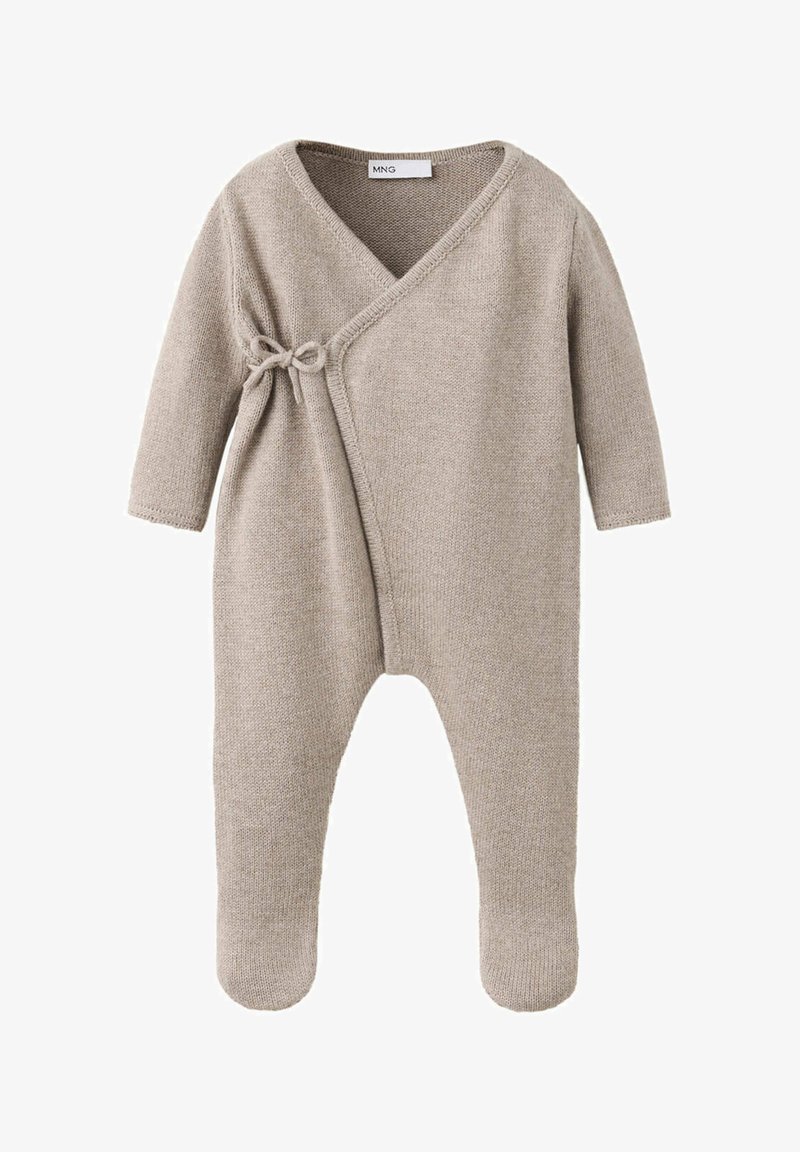Grenouillère beige en tricot pour bébé, manches longues, jambes avec pieds et fermeture à nouer sur le côté de la poitrine.