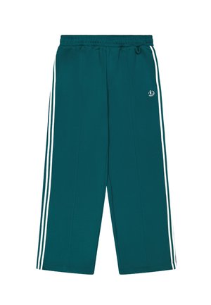 Pantaloni della tuta teal con strisce bianche sui lati, vita elastica e vestibilità ampia. Realizzati in un tessuto morbido con una superficie liscia. Piccolo logo nella parte anteriore.