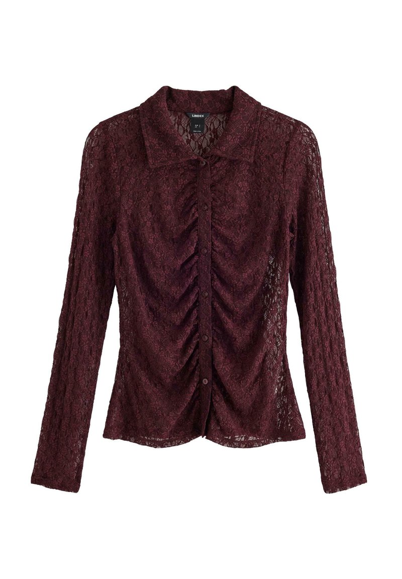 Bordeaux blonde bluse med lange ærmer, rynket frontdetalje og knaplukning. Har en klassisk krave og struktureret blomster mønster.