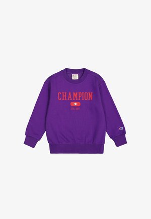 Sudadera púrpura de algodón, con la palabra "CHAMPION" en rojo en la parte delantera, puños y cintura acanalados, y parche del logo en la manga.