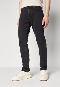 Tommy Jeans AUSTIN - Slim fit jeans - denim black