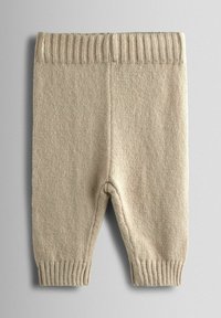Beige kudumaterjalist beebipüksid, millel on ribadega vöökoht ja kummipaelad. Omab pehmet tekstuuri ja kitsenevat jala disaini.