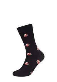Schwarze Baumwollsocken mit einem wiederholten Weihnachtsmann-Muster in Rot und Grün. Das Design zeigt den Weihnachtsmann in einem roten Outfit mit weißen Akzenten.