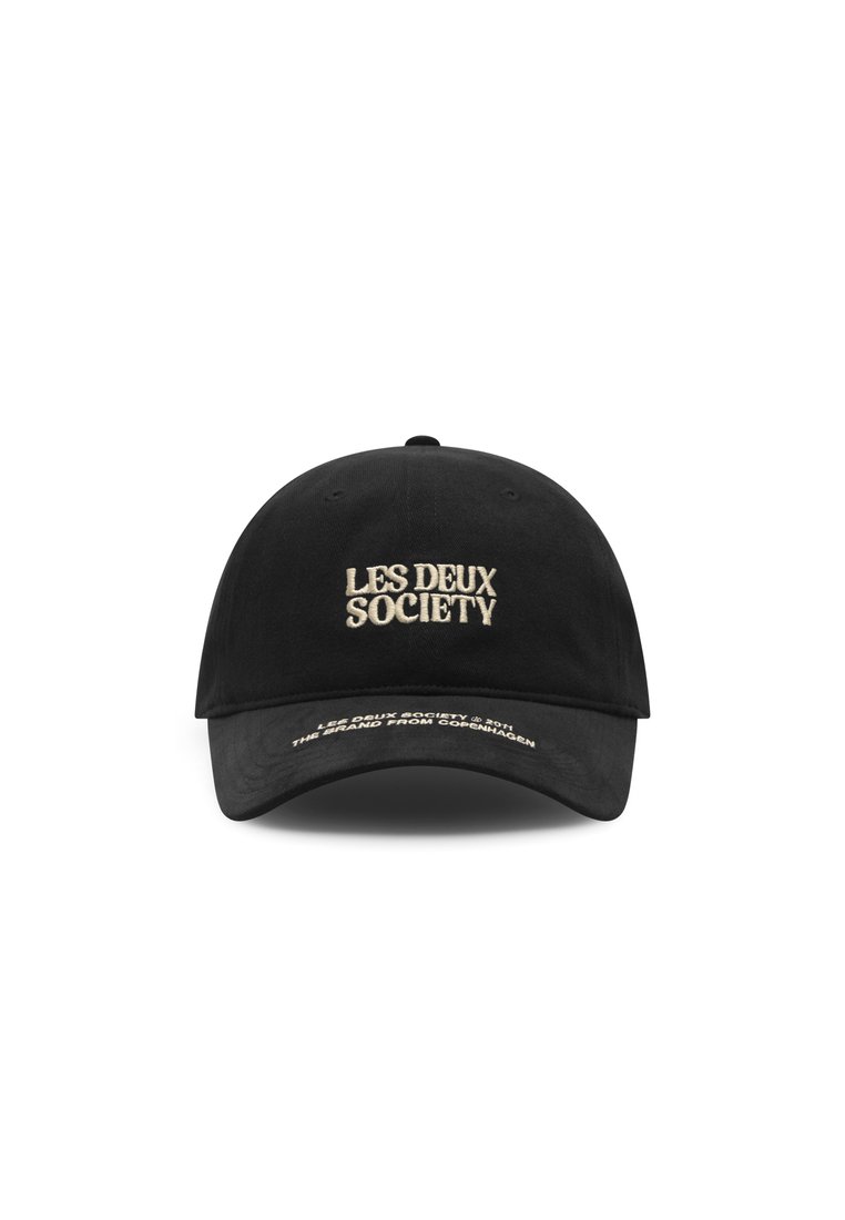 Black cotton cap with an embroidered "LES DEUX SOCIETY" logo in beige on the front. Features a curved brim and adjustable strap at the back.