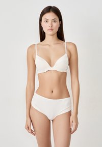 Helles beige Bikini-Set mit gepolstertem Bh und verstellbaren Trägern sowie hochgeschnittenen Hosen. Glattes, elastisches Material mit nahtlosem Design.